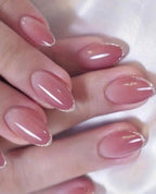 24 Pcs Round-shaped pink ombre press-on nails with delicate gold glitter tips